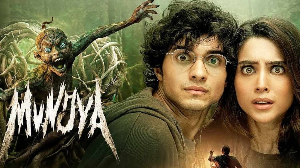 Official movie poster of Munjya" Lead Actor in Munjya , Lead actor performing in a scene from Munjya" ,Horror Scene in Munjya , A spooky scene from Munjya featuring eerie lighting" Comedy Moment in Munjya , Comedic scene from Munjya with characters laughing"Director Dinesh Vijan , Director Dinesh Vijan discussing Munjya"Supporting Cast in Munjya , Supporting cast members in a dramatic scene from Munjya" Munjya Film Set , Behind-the-scenes image of the Munjya film set"Movie Screening of Munjya , Audience watching Munjya at a movie theater" Horror-Comedy Genre Representation, Munjya blending elements of horror and comedy" Critics Reviewing Munjya , Film critics reviewing Munjya
