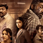 Poster of the 2024 movie 'Maharaja,' featuring Vijay Sethupathi in a powerful and intense look alongside co-stars setting against a dramatic backdrop. The image captures the film's dark undertones and powerful performances, which have been praised by critics for their emotional depth and storytelling brilliance